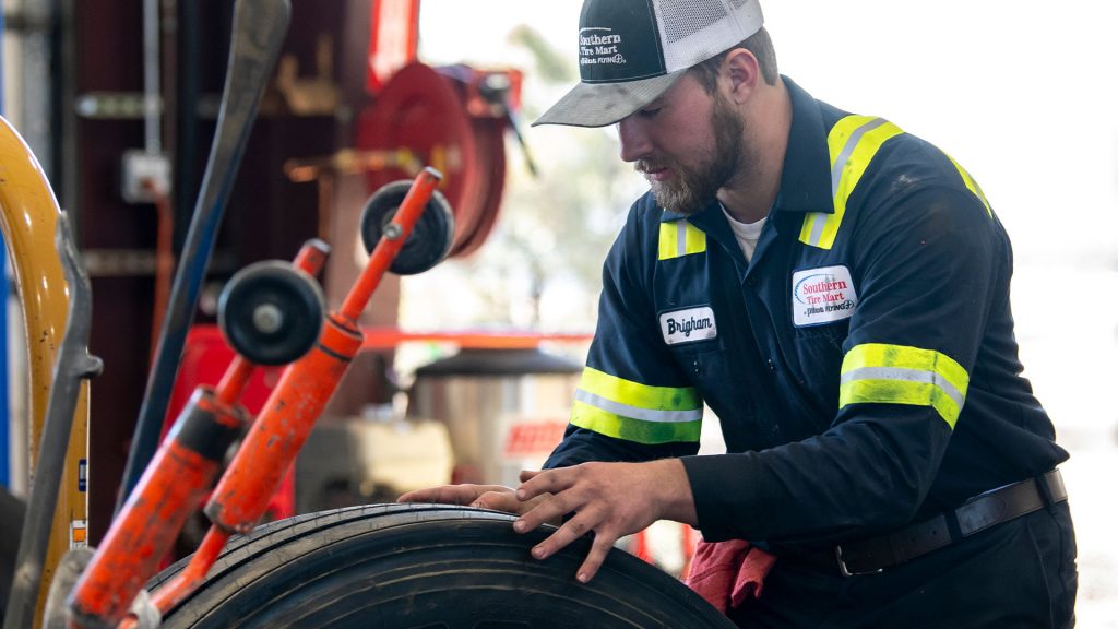 Mechanic looking at a tire