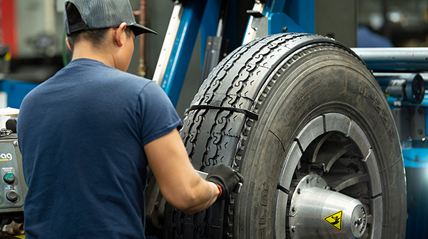 Associate working on tire